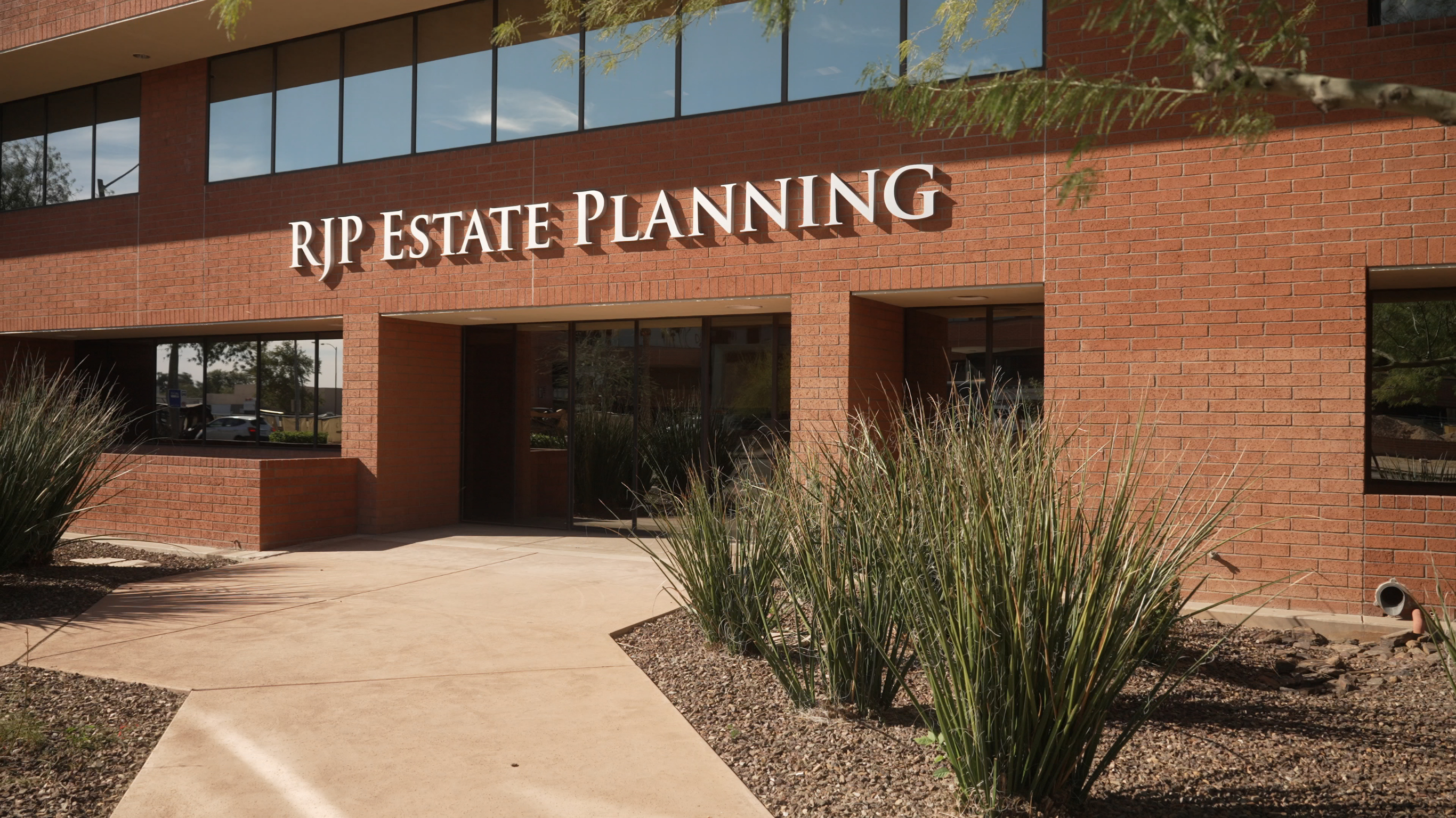 RJP Estate Planning office building exterior with brick facade and signage